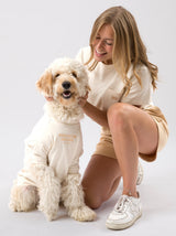 A dog wearing the Oat Embroidered Tee with Dog Club Social embroidery, Good Thomas, sold through Sniff and Shift