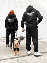 Adult wearing the Black Fleece Hoodie that matches the Fleece Hoodie (Dog), Good Thomas, sold through Sniff and Shift