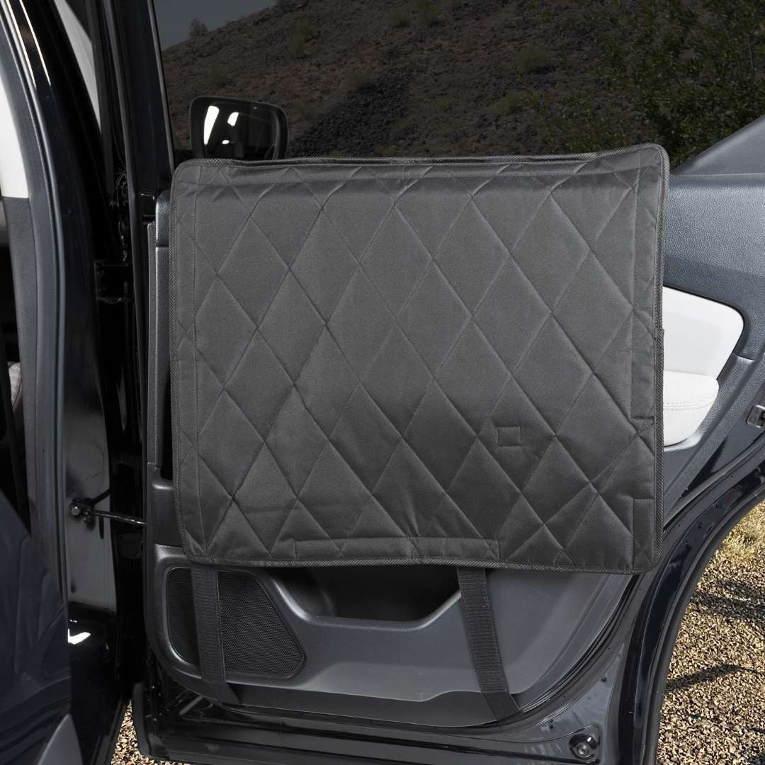 Pair of large black 4Knines quilted car door covers fitted to a rear door panel