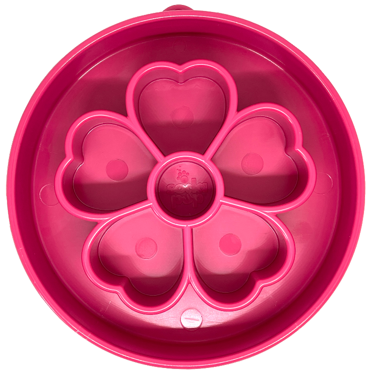 Pink and purple Flower eBowl slow feeder with petal ridge maze, next to a shallow carved feeding tray