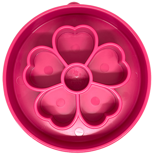 Pink and purple Flower eBowl slow feeder with petal ridge maze, next to a shallow carved feeding tray