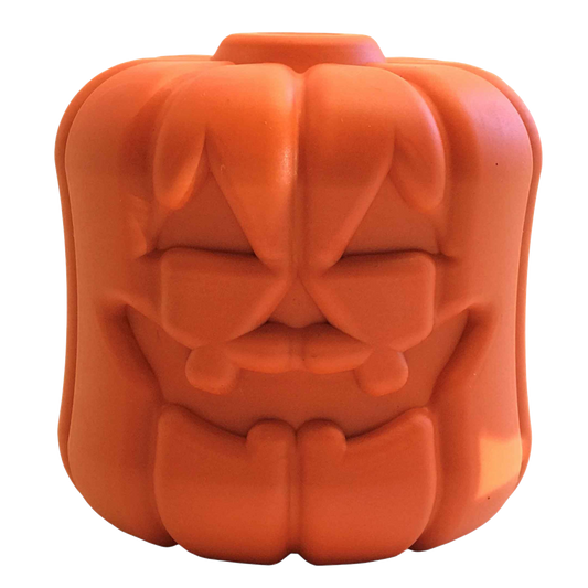 Orange rubber Jack O Lantern treat dispenser with a carved face