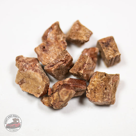 A macro shot of freeze-dried cheddar cheese bites for dogs