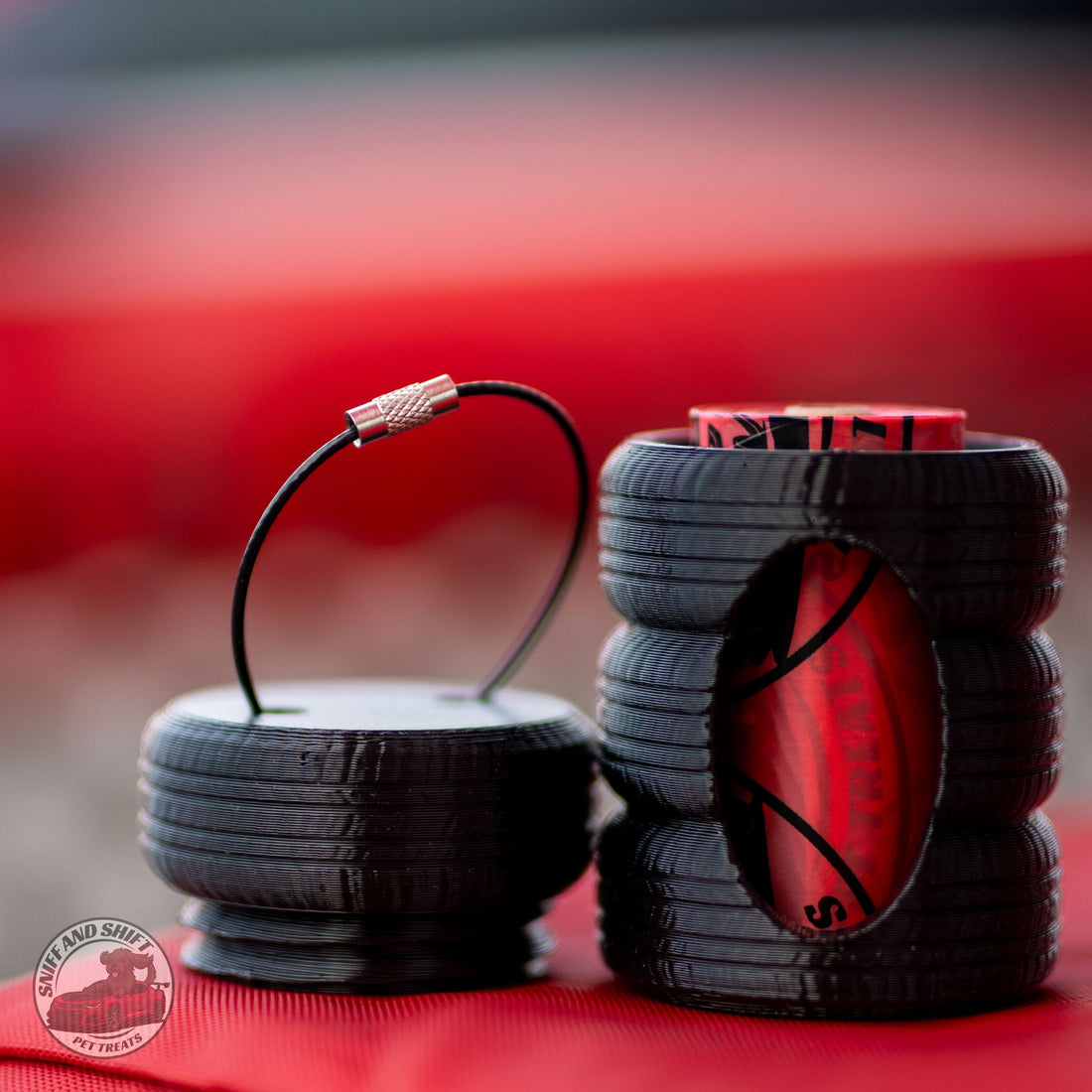 Sniff and Shift tire stack poop bag holder with the top tire unscrewed and a bag roll inside