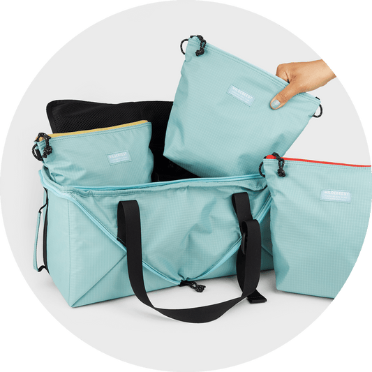 Bernal Transformer Travel Bag shown as cube and duffle, in Sky Blue and Black, Wildebeest, sold through Sniff and Shift