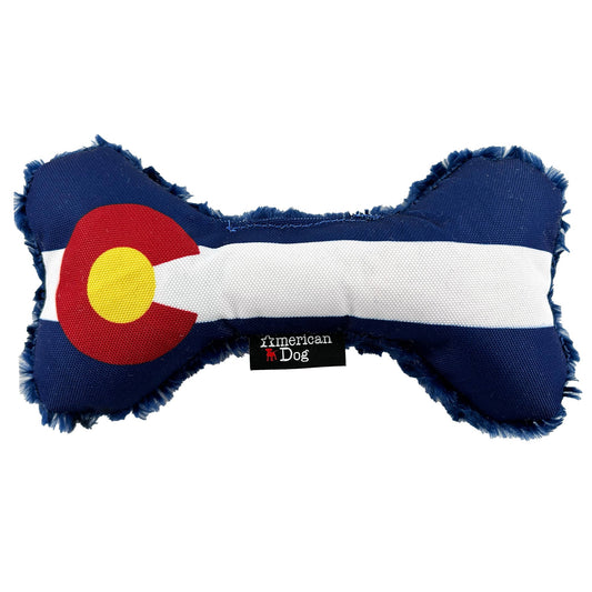 Colorado Flag Bone dog toy by American Dog, 1000D nylon front with the Colorado flag and a blue swirly fleece back