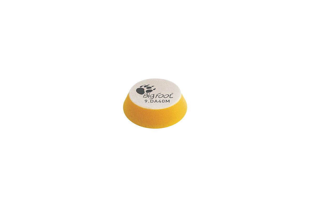 RUPES D-A Fine 1.5 inch yellow foam polishing pad shown loose, marked 9.DA40M