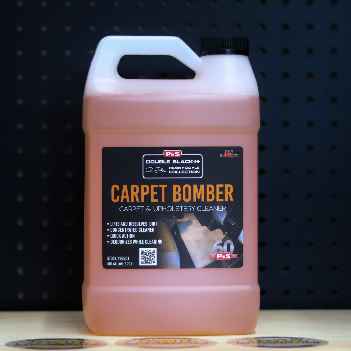 P&S Carpet Bomber one gallon translucent jug of orange liquid with a Double Black Carpet and Upholstery Cleaner label