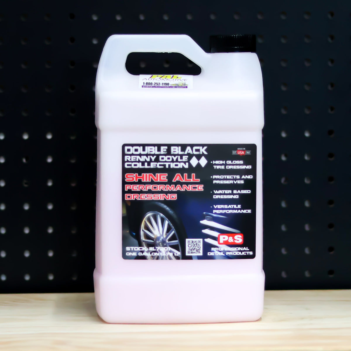 P&S Shine All Performance Dressing gallon jug of pale pink liquid with the black Double Black Renny Doyle Collection label showing a wheel