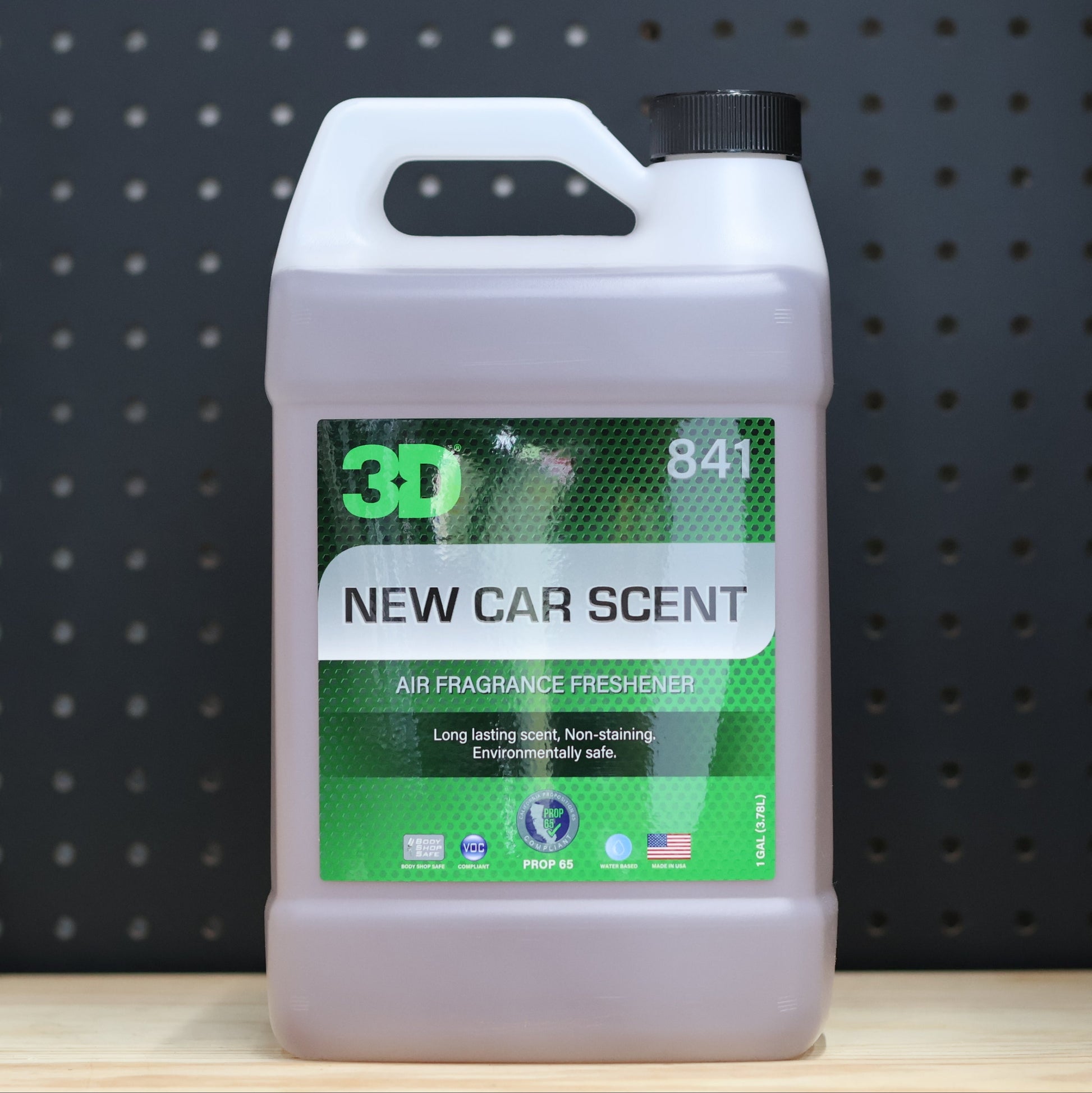 3D New Car Scent air freshener jug of pale liquid with the green and black 841 label