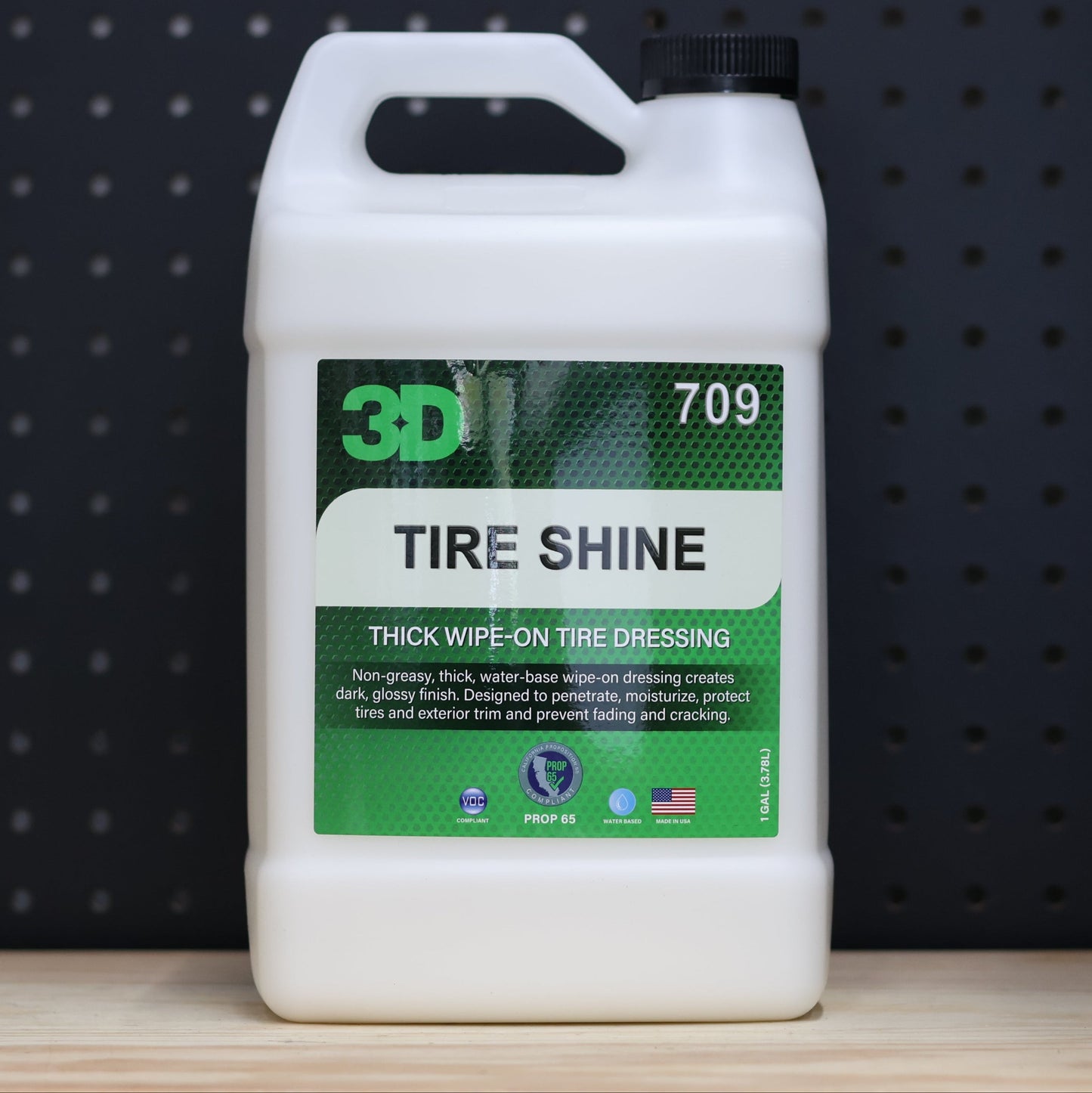 3D Tire Shine 1 gallon jug, white plastic with a green and black tire dressing label and a carry handle