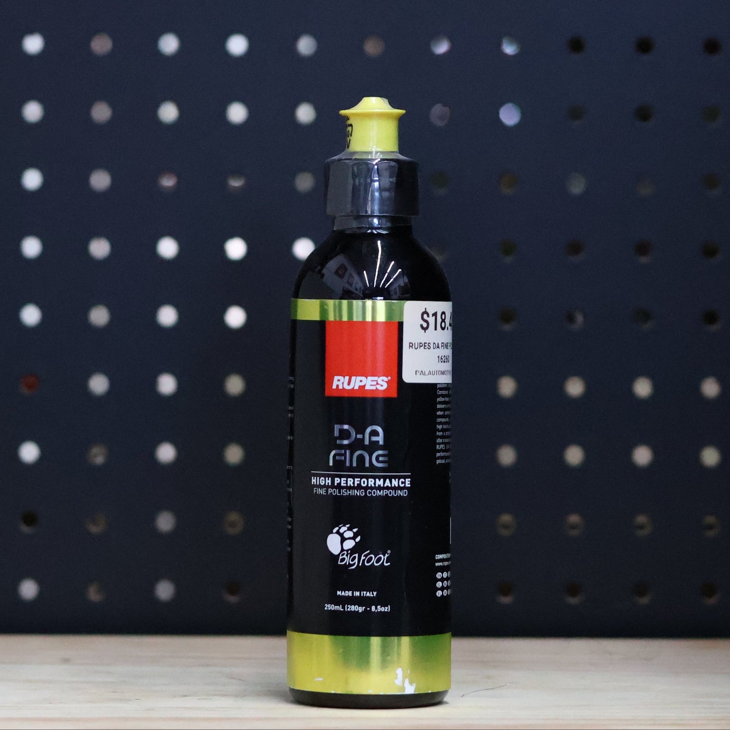 RUPES D-A Fine polishing compound 250 ml black bottle with a yellow cap and a yellow label band