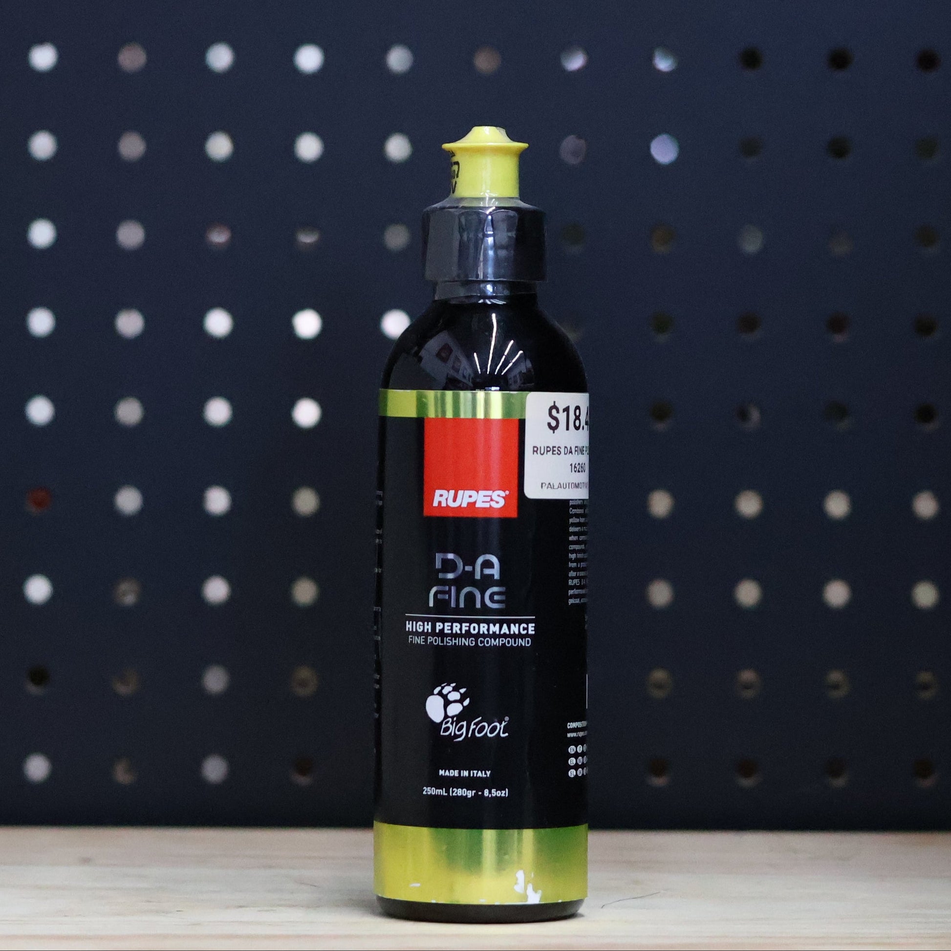 RUPES D-A Fine polishing compound 250 ml black bottle with a yellow cap and a yellow label band