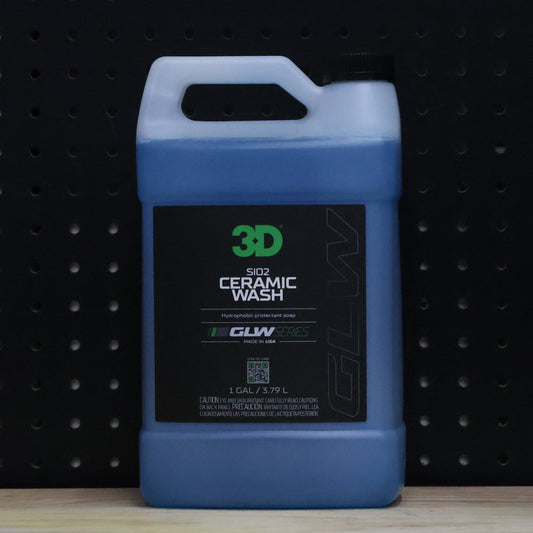 3D GLW SiO2 Ceramic Wash 1 gallon jug of blue soap with a black GLW Series label and black cap on a pegboard wall