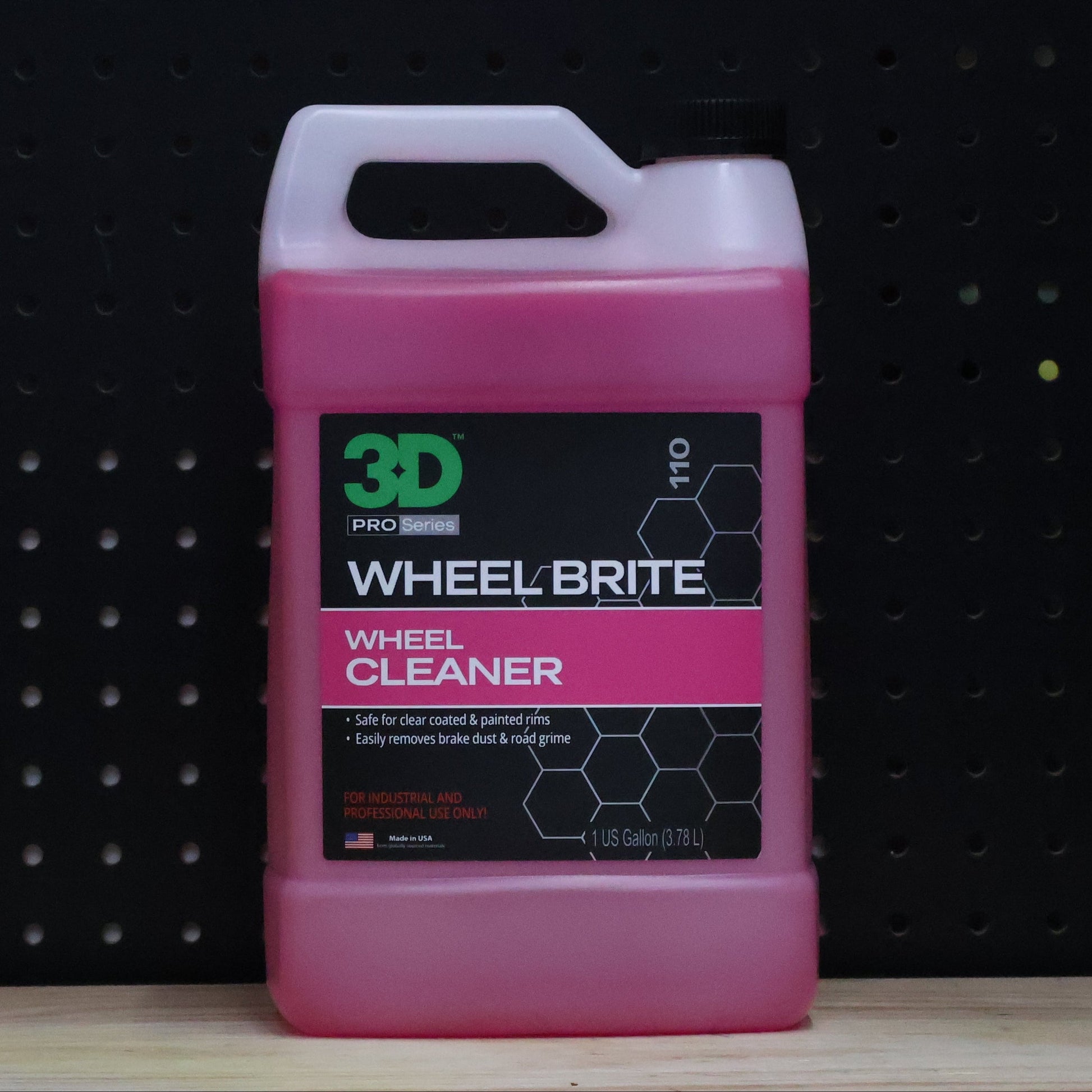 3D Wheel Brite wheel cleaner in a one gallon jug of pink liquid with a white handle