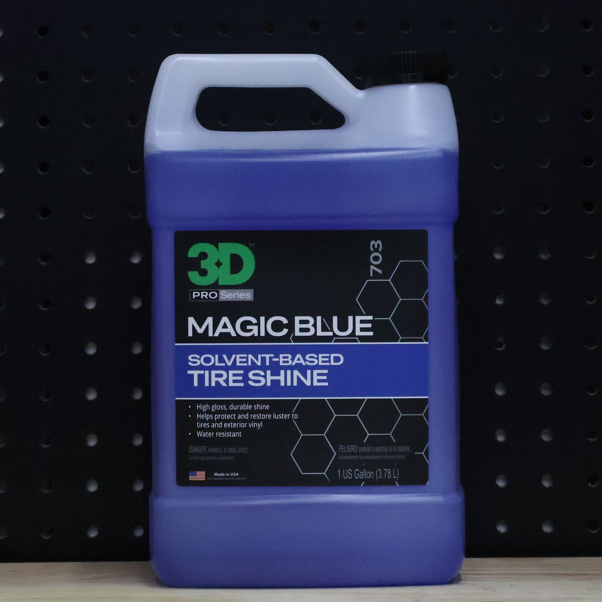 3D Magic Blue Tire Dressing one gallon jug of dark blue dressing with a black 7703 label