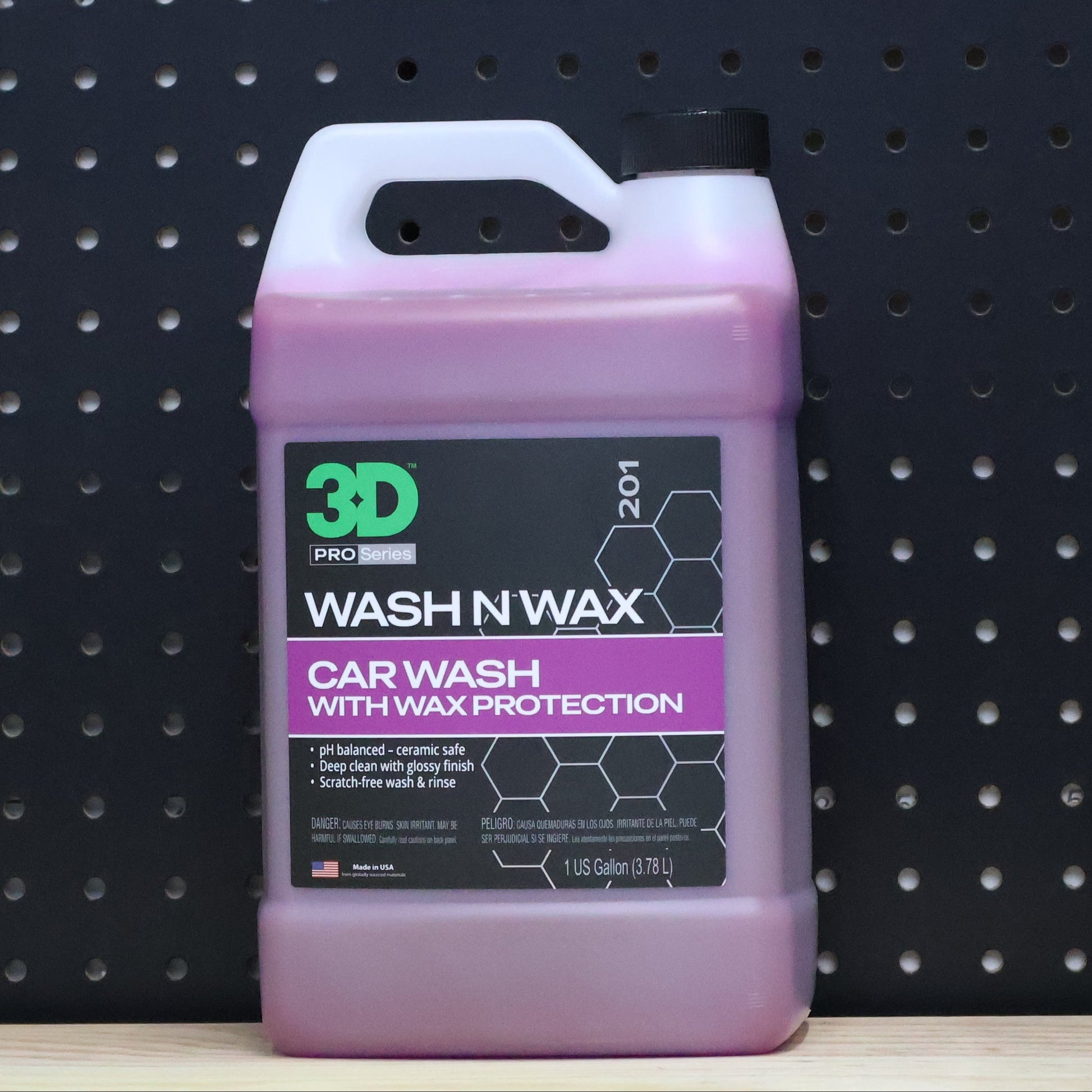 3D Wash N Wax 1 gallon jug, pink tinted bottle with a purple and black car wash label and a carry handle