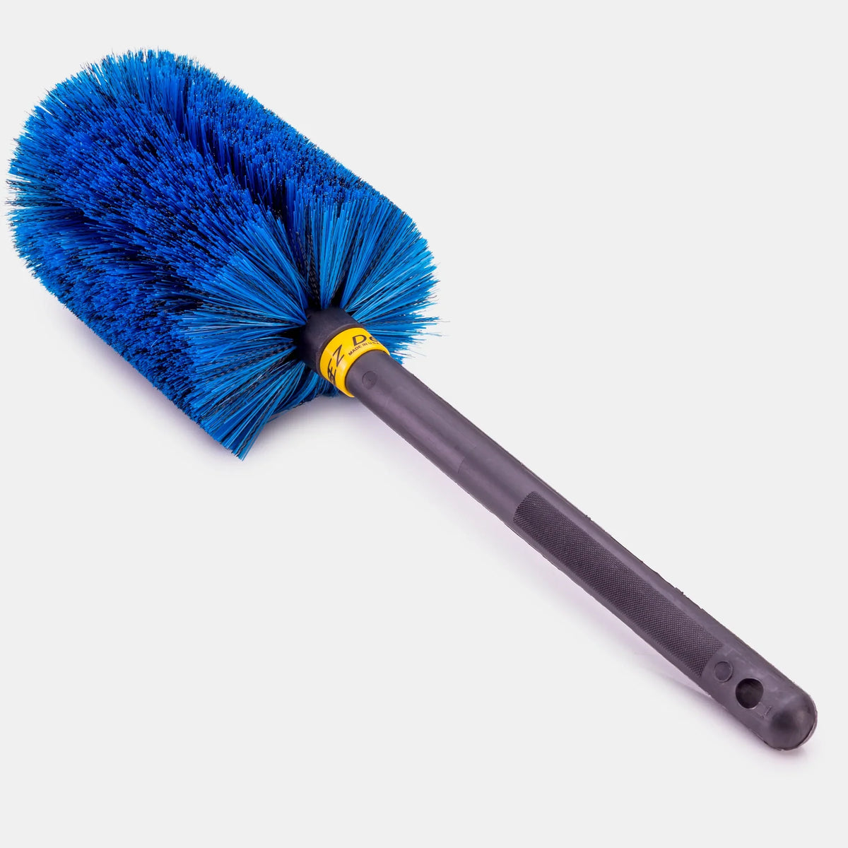 Go EZ wheel brush with blue soft bristles on a long black plastic handle