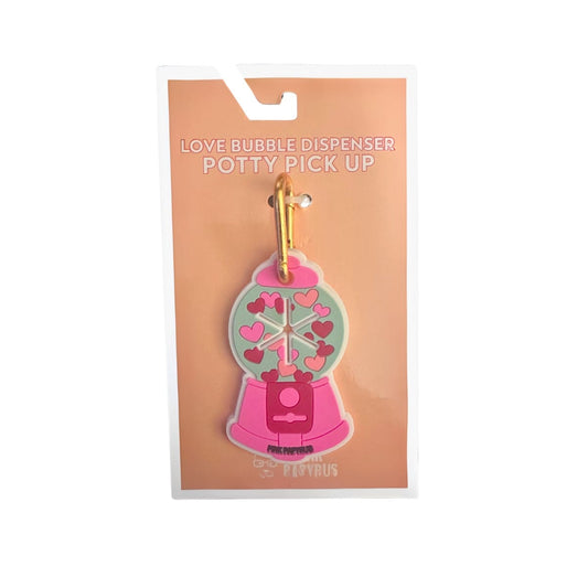 Love Bubble Dispenser Potty Pick Up, a rubber heart-dispensing bag charm, Pink Papyrus Co., sold through Sniff and Shift