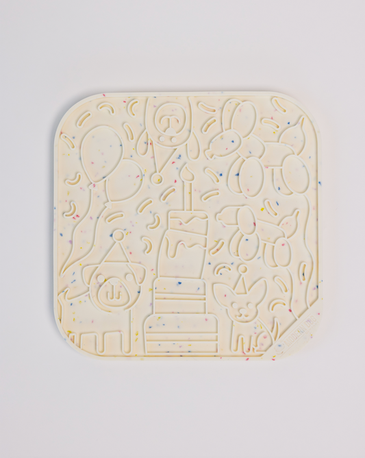 It's a Birthday Pawty silicone lick mat with suction cups by The Modern Dog Company, sold through Sniff and Shift