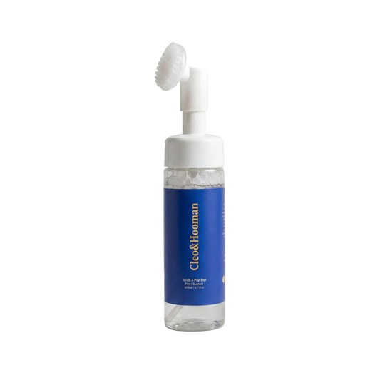 Cleo&Hooman Scrub-a-Pup-Pup paw cleanser in a clear 200 ml foaming bottle with a blue label and a white silicone brush head
