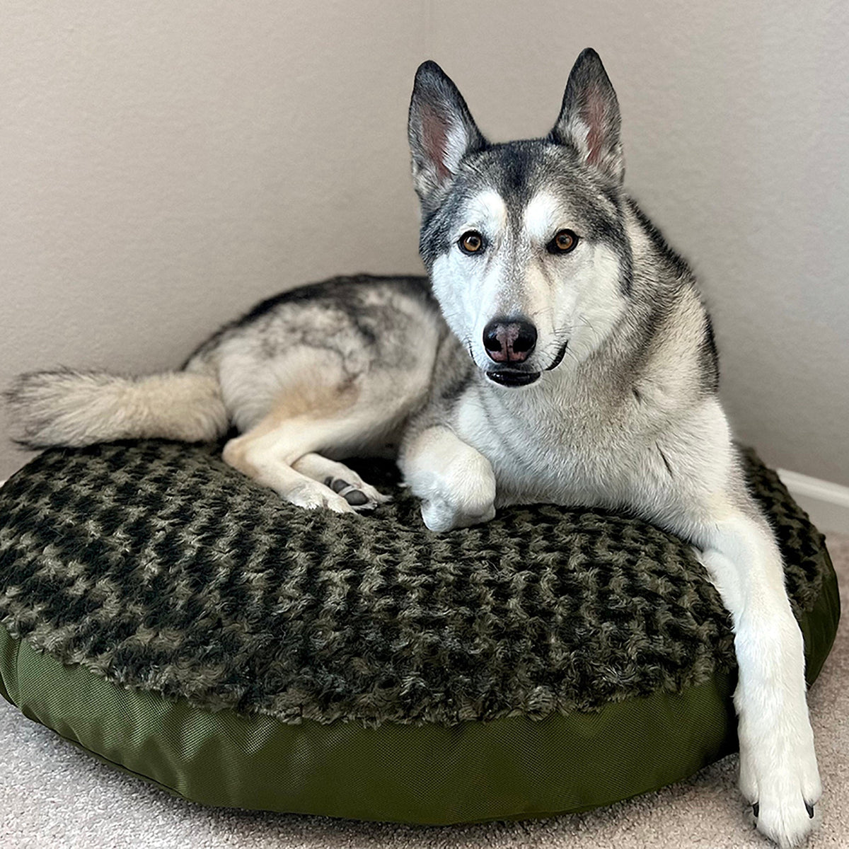 Round Furvana dog bed by American Dog in soft minky rose fleece with a 1680D nylon ballistic bottom