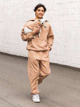 Adult wearing the Sandstone Fleece Hoodie from the fleece hoodie line, Good Thomas, sold through Sniff and Shift